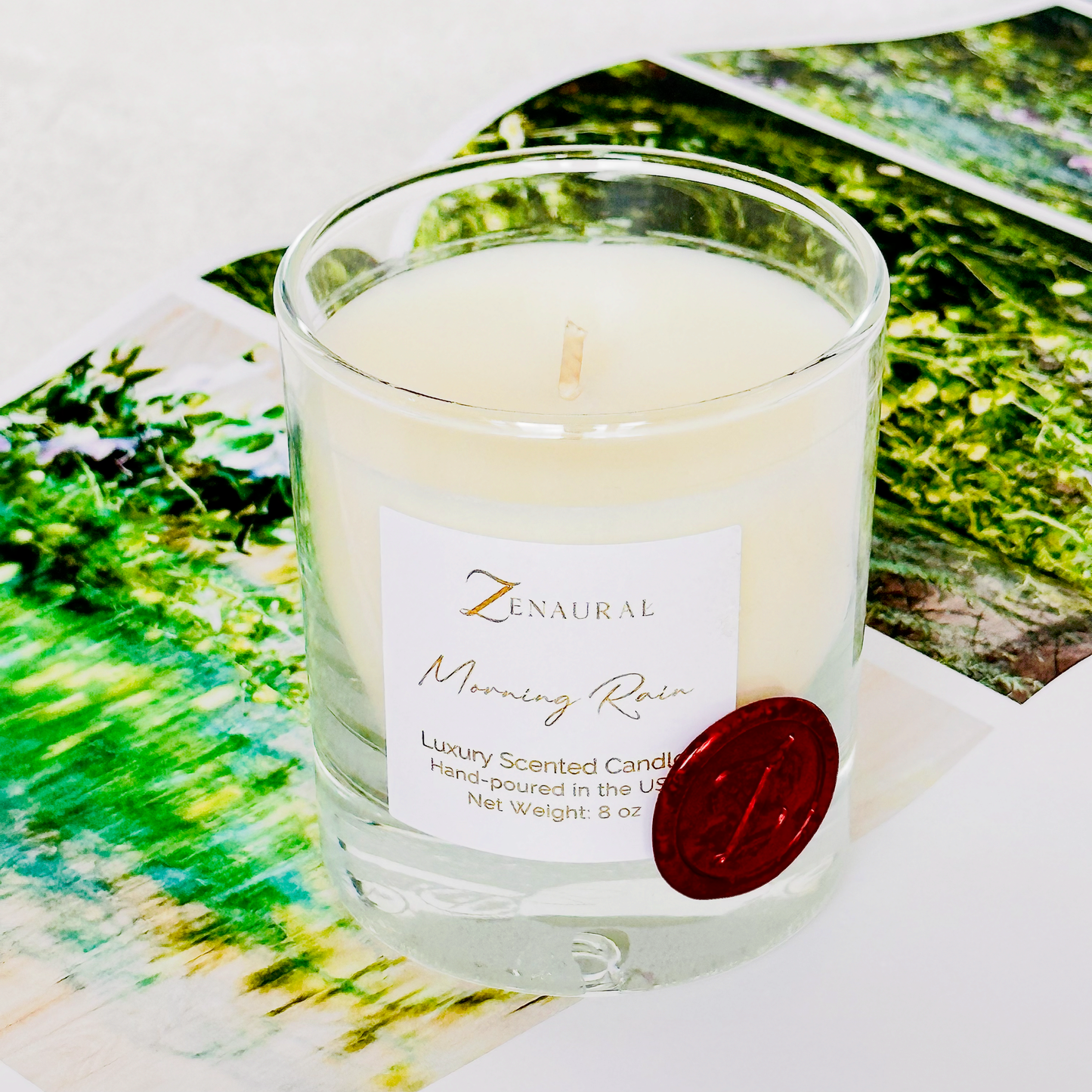 Morning Rain — green-tinted glass candle with white Zenaural label and wooden wick, Veloria Collection by Zenaura Studio.