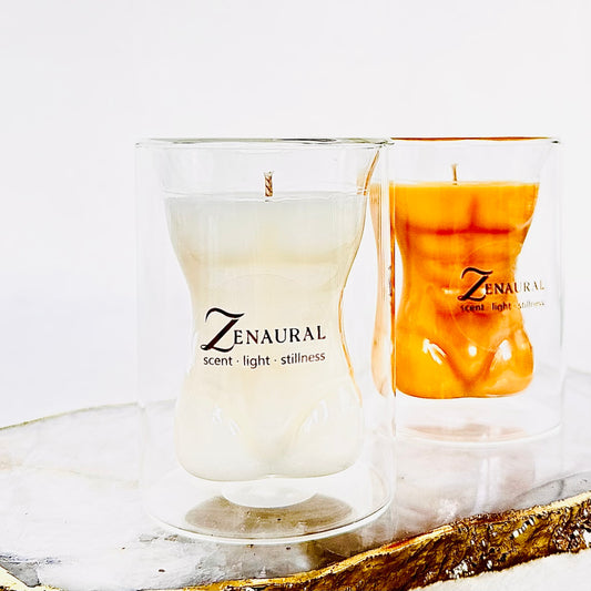 Atelier Form Duo — Ivory Form and Amber Form sculptural torso candles in double-walled borosilicate glass on a marble tray, Zenaura Studio.