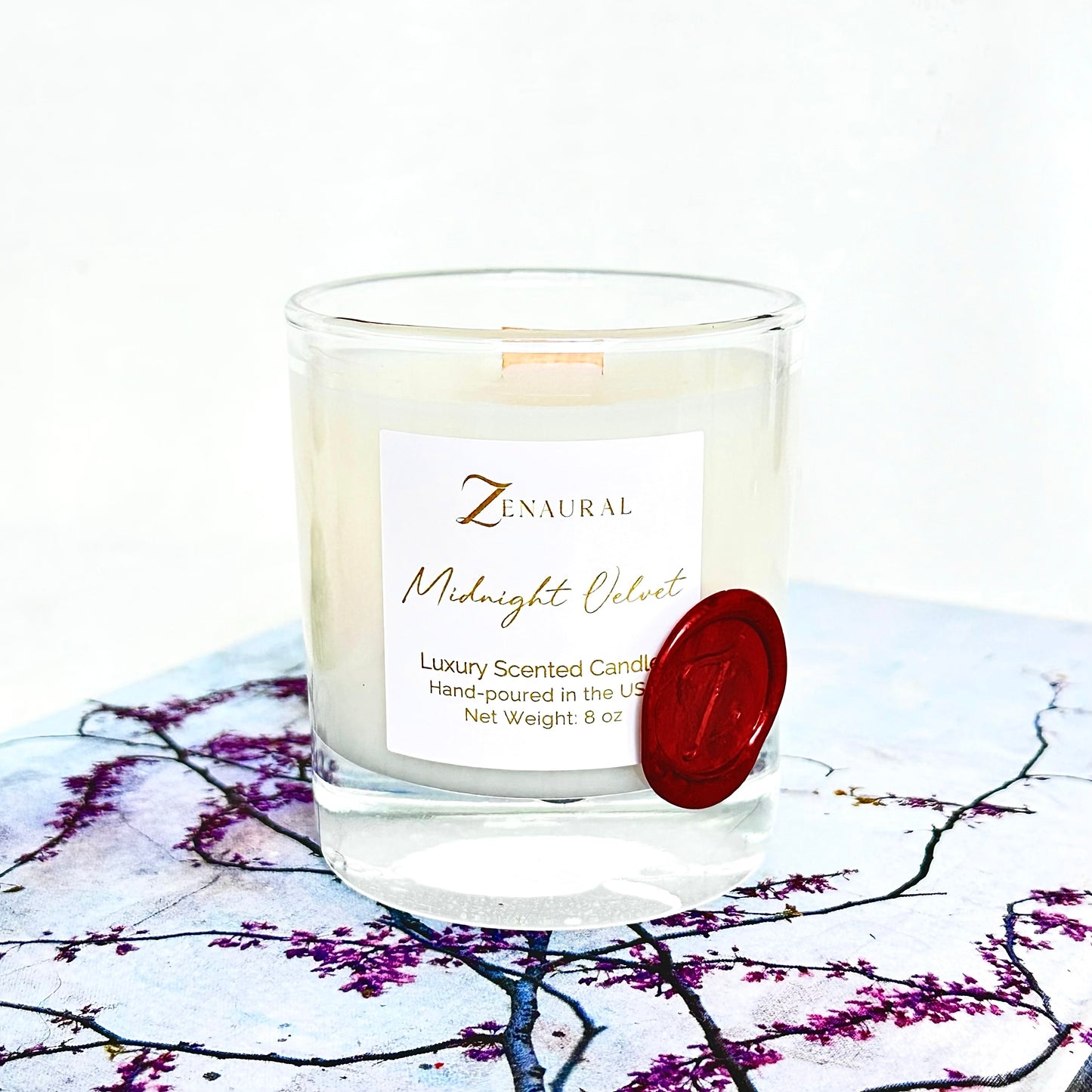 Midnight Velvet — deep navy/black glass candle with white Zenaural label and wooden wick, Veloria Collection by Zenaura Studio.